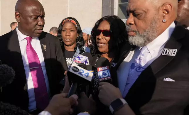 RowVaughn Wells, second from right, mother of Tyre Nichols, speaks during a news conference outside the federal courthouse after three former Memphis police officers were convicted of witness tampering charges in the 2023 fatal beating of Nichols, Thursday, Oct. 3, 2024, in Memphis, Tenn. (AP Photo/George Walker IV)