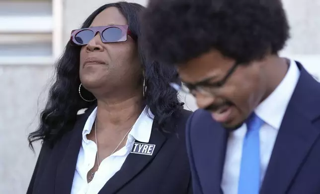 RowVaughn Wells, left, mother of Tyre Nichols, prays with Rep. Justin J. Pearson, D-Memphis, right, before entering the federal courthouse for the trial of three former Memphis police officers charged in the 2023 fatal beating of her son Wednesday, Oct. 2, 2024, in Memphis, Tenn. (AP Photo/George Walker IV)