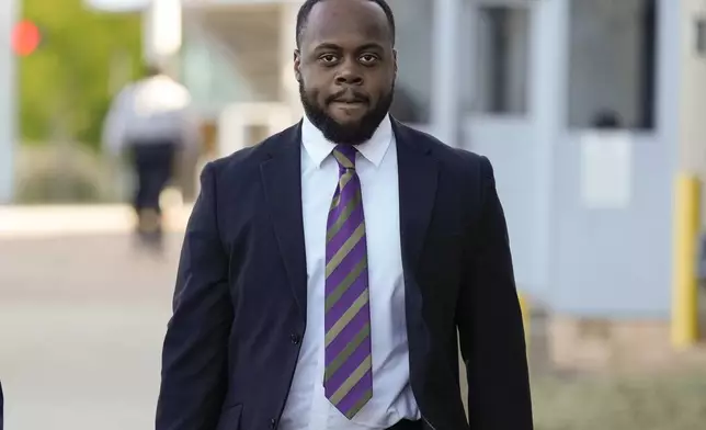 Tadarrius Bean one of three former Memphis police officers charged in the 2023 fatal beating of Tyre Nichols, arrives at the federal courthouse for the day's proceedings Wednesday, Oct. 2, 2024, in Memphis, Tenn. (AP Photo/George Walker IV)