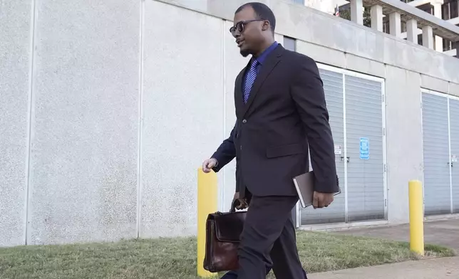 Justin Smith, one of three former Memphis police officers charged in the 2023 fatal beating of Tyre Nichols, arrives at the federal courthouse for the day's proceedings Wednesday, Oct. 2, 2024, in Memphis, Tenn. (AP Photo/George Walker IV)