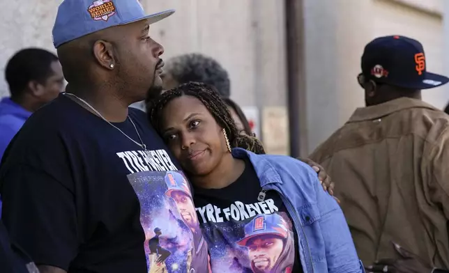 Jamal Dupree, left, and La'Toya Yizar, right, comfort each other during a prayer vigil outside the federal courthouse as jury deliberations begin for the trial of three former Memphis police officers charged in the 2023 fatal beating of their brother, Tyre Nichols, Thursday, Oct. 3, 2024, in Memphis, Tenn. (AP Photo/George Walker IV)