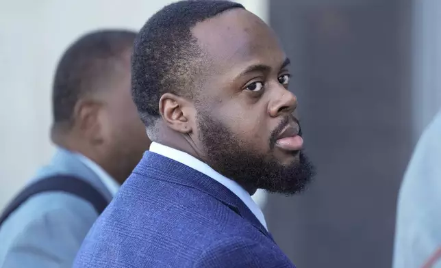 Tadarrius Bean, one of three former Memphis police officers charged in the 2023 fatal beating of Tyre Nichols, arrives at the federal courthouse for the day's proceedings Thursday, Oct. 3, 2024, in Memphis, Tenn. (AP Photo/George Walker IV)