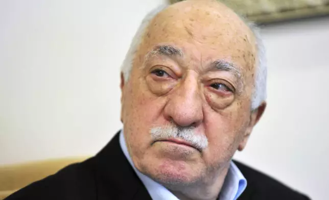 FILE - Turkish Islamic cleric Fethullah Gulen speaks to members of the media at his compound in Saylorsburg, Pa. in July 2016. (AP Photo/Chris Post, File)