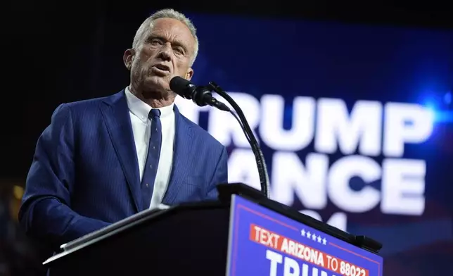 FILE - Independent presidential candidate Robert F. Kennedy Jr. speaks as he endorses Republican presidential nominee former President Donald Trump at a campaign rally at the Desert Diamond Arena, Aug. 23, 2024, in Glendale, Ariz. (AP Photo/Evan Vucci, File)