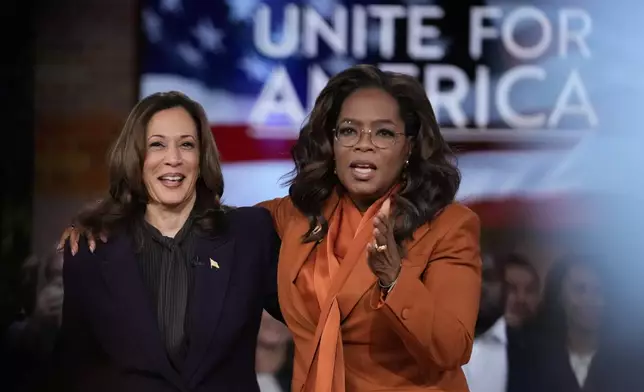 FILE - Democratic presidential nominee Vice President Kamala Harris joins Oprah Winfrey at Oprah's Unite for America Live Streaming event, Sept. 19, 2024, in Farmington Hills, Mich. (AP Photo/Paul Sancya, File)