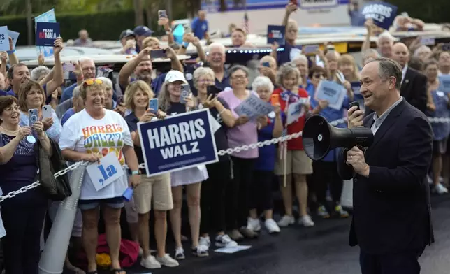 FILE - Second gentleman Doug Emhoff speaks at the start of a golf cart parade in support of his wife, Democratic presidential nominee Vice President Kamala Harris, in The Villages, Fla., Sept. 13, 2024. (AP Photo/Rebecca Blackwell, File)