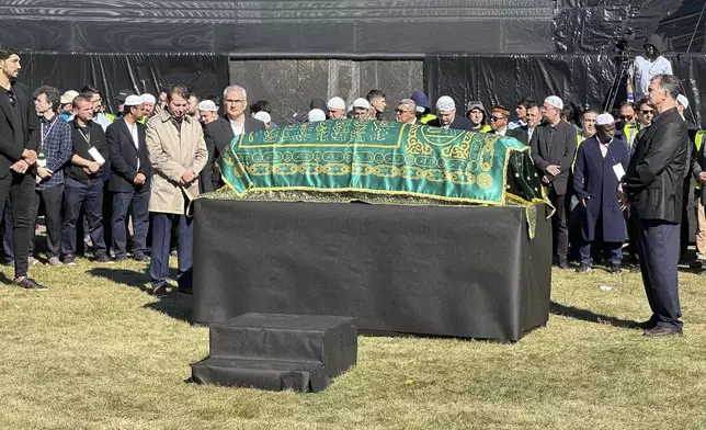 A casket bearing the body of Fethullah Gülen, a Muslim cleric living in exile in the United States and faced unproven allegations that he orchestrated a failed 2016 coup in Turkey, sits in Skylands Stadium in Augusta, N.J., where thousands gathered for funeral prayers on Thursday Oct. 24. 2024. (AP Photo/Mike Rubinkam)