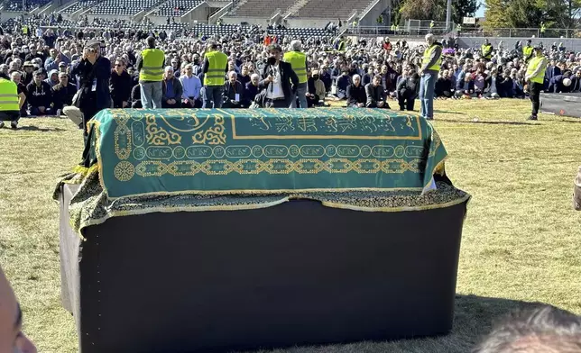 A casket bearing the body of Fethullah Gülen, a Muslim cleric living in exile in the United States and faced unproven allegations that he orchestrated a failed 2016 coup in Turkey, sits in Skylands Stadium in Augusta, New Jersey, where thousands gathered for funeral prayers on Thursday Oct. 24. 2024. (AP Photo/Mike Rubinkam)