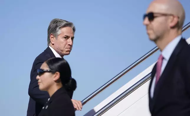 Secretary of State Antony Blinken walks to board a plane en route to the Middle East as he departs Joint Base Andrews, Md., Monday, Oct. 21, 2024. (Nathan Howard/Pool Photo via AP)