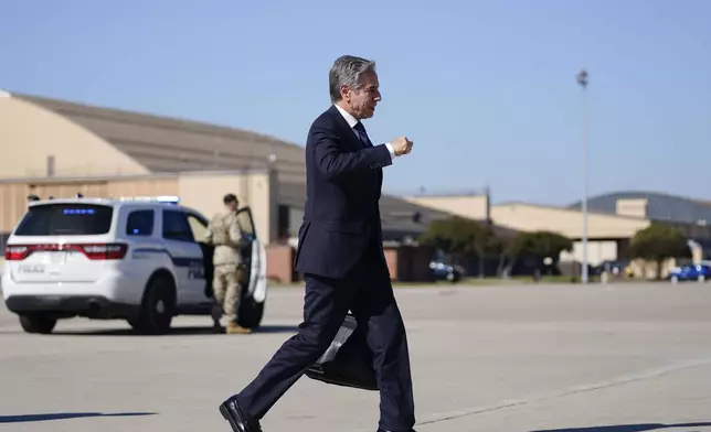 Secretary of State Antony Blinken walks to board a plane en route to the Middle East as he departs Joint Base Andrews, Md., Monday, Oct. 21, 2024. (Nathan Howard/Pool Photo via AP)