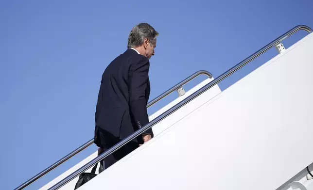 Secretary of State Antony Blinken walks to board a plane en route to the Middle East as he departs Joint Base Andrews, Md., Monday, Oct. 21, 2024. (Nathan Howard/Pool Photo via AP)