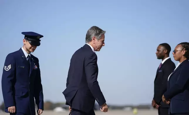 Secretary of State Antony Blinken walks to board a plane en route to the Middle East as he departs Joint Base Andrews, Md., Monday, Oct. 21, 2024. (Nathan Howard/Pool Photo via AP)