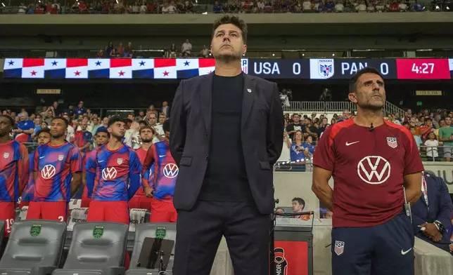 United States head coach Mauricio Pochettino, front left, and first assistant coach Jesus Perez, right, stand for the national anthem before an international friendly soccer match against Panama, Saturday, Oct. 12, 2024, in Austin, Texas. (AP Photo/Rodolfo Gonzalez)