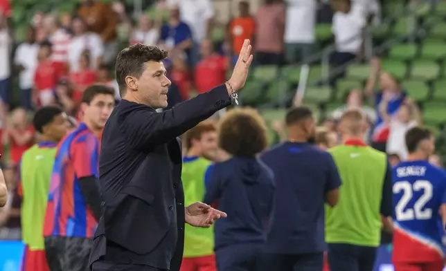 United States head coach, Mauricio Pochettino, celebrates with fans after defeating Panama in an international friendly soccer match, Saturday, Oct. 12, 2024, in Austin, Texas. (AP Photo/Rodolfo Gonzalez)