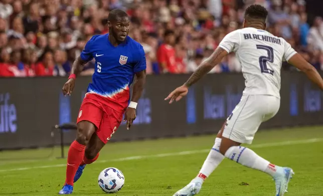 United States midfielder Yunus Musah, left, takes on Panama defender Austin Trusty (2) during the first half of an international friendly soccer match, Saturday, Oct. 12, 2024, in Austin, Texas. (AP Photo/Rodolfo Gonzalez)