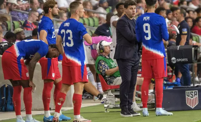 United States head coach, Mauricio Pochettino, speaks with forward, Ricardo Pepi, (9), before a substitution against Panama during the second half of a international friendly soccer match, Saturday, Oct. 12, 2024, in Austin, Texas. (AP Photo/Rodolfo Gonzalez)