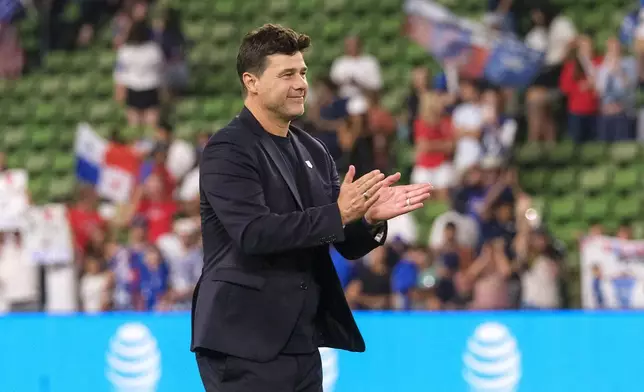 United States head coach Mauricio Pochettino celebrates with fans after defeating Panama in an international friendly soccer match, Saturday, Oct. 12, 2024, in Austin, Texas. (AP Photo/Rodolfo Gonzalez)