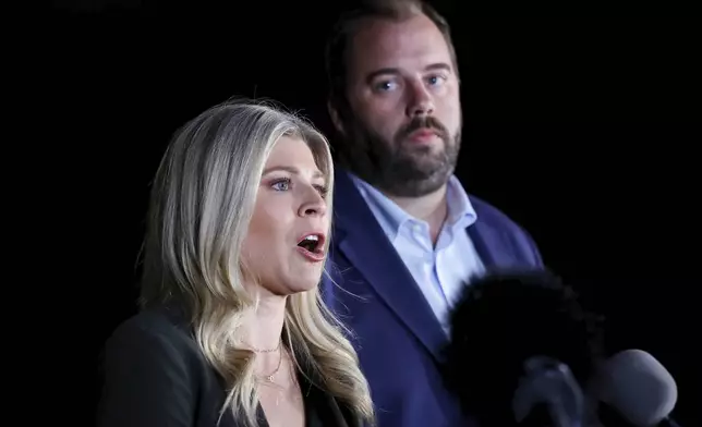 Texas state representatives Lacey Hull, left, and John Bucy III comment during a press conference after the stay granted by the Texas Supreme Court to halt the execution of Robert Roberson, at the Huntsville Unit of the Texas State Penitentiary, Thursday, Oct. 17, 2024, in Huntsville, Texas. (AP Photo/Michael Wyke)