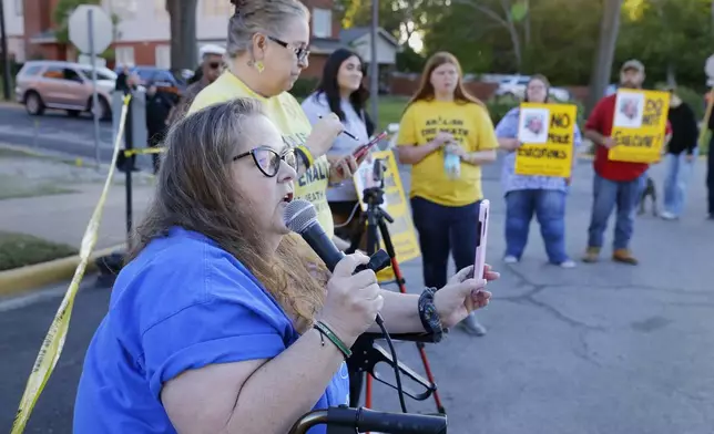 Dani Allen, an anti-death penalty advocate, speaks during a protest outside the prison where Robert Roberson is scheduled for execution at the Huntsville Unit of the Texas State Penitentiary, Thursday, Oct. 17, 2024, in Huntsville, Texas. (AP Photo/Michael Wyke)