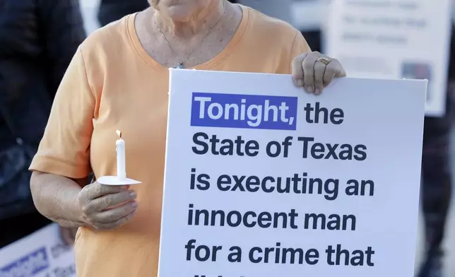 Ann Dorn, a local Catholic parishioner opposed to the death penalty, protest outside the prison where Robert Roberson is scheduled for execution at the Huntsville Unit of the Texas State Penitentiary, Thursday, Oct. 17, 2024, in Huntsville, Texas. (AP Photo/Michael Wyke)