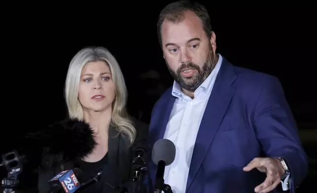 Texas state representatives Lacey Hull, left, and John Bucy III comment during a press conference after the stay granted by the Texas Supreme Court to halt the execution of Robert Roberson, at the Huntsville Unit of the Texas State Penitentiary, Thursday, Oct. 17, 2024, in Huntsville, Texas. (AP Photo/Michael Wyke)