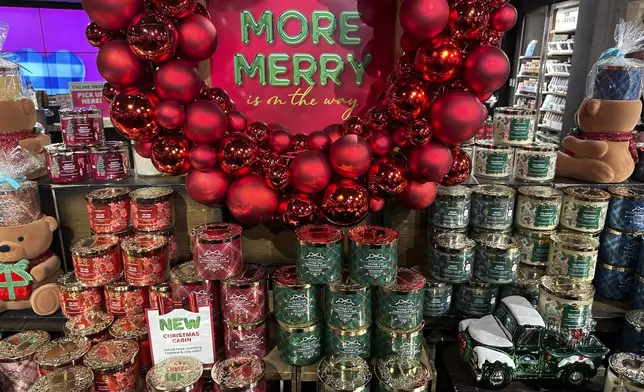 An arrangement of holiday themed scented candles is shown at a Bath and Body Works store on Wednesday, Oct. 9, 2024, in New York. (AP Photo/Peter Morgan)