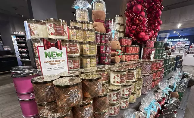 An arrangement of holiday themed scented candles is shown at a Bath and Body Works store on Wednesday, Oct. 9, 2024, in New York. (AP Photo/Peter Morgan)