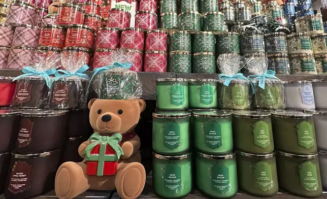 An arrangement of holiday themed scented candles is shown at a Bath and Body Works store on Wednesday, Oct. 9, 2024, in New York. (AP Photo/Peter Morgan)