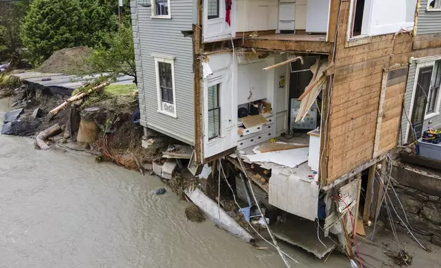 FILE - The remains of an apartment building are visible in Plainfield, Vt., July 12, 2024, after floodwaters and debris from the aftermath of Hurricane Beryl pulled several apartments into the Great Brook waterway. (AP Photo/Ted Shaffrey, File)