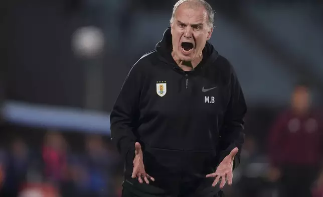 Uruguay's coach Marcelo Bielsa reacts during a FIFA World Cup 2026 qualifying soccer match against Ecuador at the Centenario stadium in Montevideo, Uruguay, Tuesday, Oct. 15, 2024. (AP Photo/Matilde Campodonico)