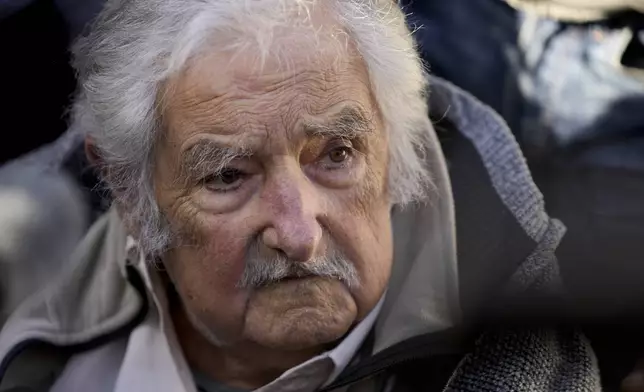 Former Uruguayan President Jose "Pepe" Mujica talks to journalists after voting at a polling station during general elections in Montevideo, Uruguay, Sunday, Oct. 27, 2024. (AP Photo/Natacha Pisarenko)