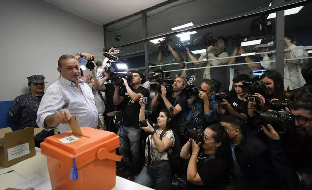 Alvaro Delgado, presidential candidate for the ruling National Party, votes at a polling station during general elections in Montevideo, Uruguay, Sunday, Oct. 27, 2024. (AP Photo/Natacha Pisarenko)