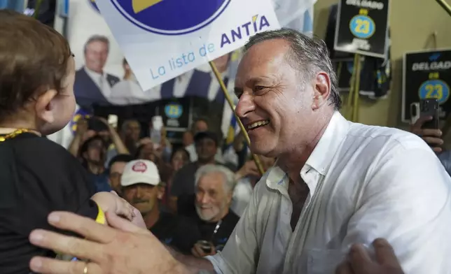 Alvaro Delgado, presidential candidate for the ruling National Party, smiles at a rally six days ahead of presidential elections, in Maldonado, Uruguay, Monday, Oct. 21, 2024. (AP Photo/Matilde Campodonico)