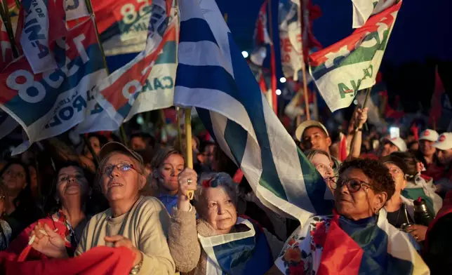 Supporters of Frente Amplio presidential candidate Yamandu Orsi attend a rally five days ahead of elections in Montevideo, Uruguay, Tuesday, Oct. 22, 2024. (AP Photo/Matilde Campodonico)