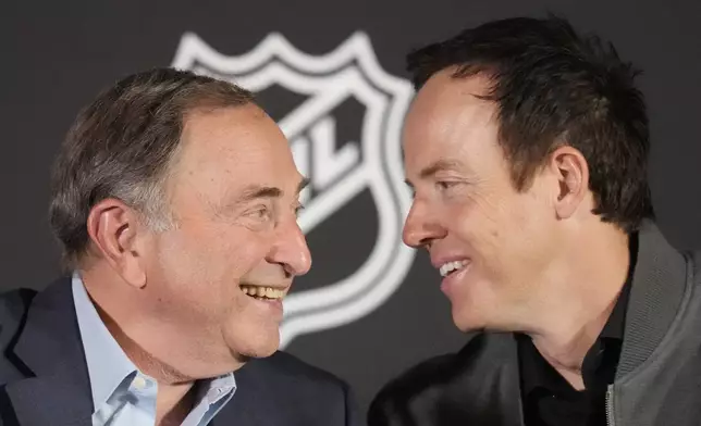 FILE - NHL Commissioner Gary Bettman, left, and Ryan Smith, co-founder and chairman of Smith Entertainment Group, speak during a news conference Friday, April 19, 2024, in Salt Lake City about the move of the Arizona Coyotes franchise to Salt Lake City. (AP Photo/Rick Bowmer, File)