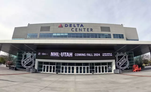 FILE - Signs celebrating the awarding of a new NHL team to Utah are shown at the Delta Center Friday, April 19, 2024, in Salt Lake City. (AP Photo/Rick Bowmer, File)