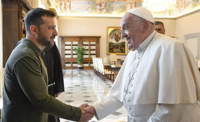 Ukraine's President Volodymyr Zelenskyy, left, arrives for a private audience with Pope Francis at The Vatican, Friday, Oct. 11, 2024. (Vatican Media via AP)