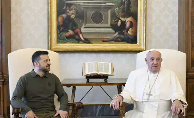 Ukraine's President Volodymyr Zelenskyy, left, arrives for a private audience with Pope Francis at The Vatican, Friday, Oct. 11, 2024. (Vatican Media via AP)