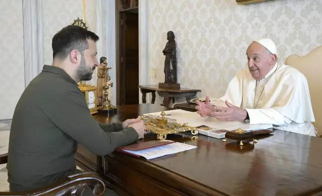 Ukraine's President Volodymyr Zelenskyy, left, arrives for a private audience with Pope Francis at The Vatican, Friday, Oct. 11, 2024. (Vatican Media via AP)