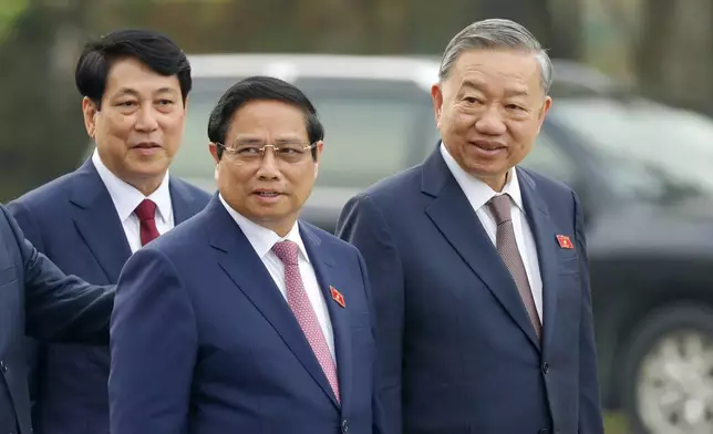 Vietnam's newly elected President Luong Cuong, from left, Prime Minister Pham Minh Chinh and General Secretary of the Communist Party To Lam are seen outside the National Assembly in Hanoi, Vietnam on Monday, Oct.21, 2024. (AP Photo/Minh Hoang)