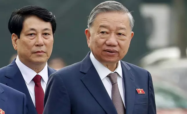 Vietnam's newly elected President Luong Cuong, left, and General Secretary of the Communist Party To Lam are seen outside the National Assembly in Hanoi, Vietnam on Monday, Oct. 21, 2024. (AP Photo/Minh Hoang)