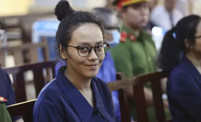 Truong Hue Van, niece of Vietnamese real estate tycoon Truong My Lan, sits in court to wait for her verdict for her involvement in Lan's case in Ho Chi Minh city, Vietnam Thursday, Oct. 17, 2024. (Quynh Tran/VNExpress via AP)