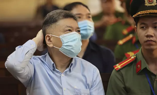 Chu Nap Kee, husband of Vietnamese real estate tycoon Truong My Lan, sits in court to wait for her verdict for his involvement in Lan's case in Ho Chi Minh city, Vietnam Thursday, Oct. 17, 2024. (Quynh Tran/VnExpress via AP)