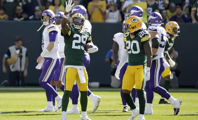 Green Bay Packers safety Xavier McKinney (29) celebrates an interception during the second half of an NFL football game against the Minnesota Vikings, Sunday, Sept. 29, 2024, in Green Bay, Wis. (AP Photo/Mike Roemer)