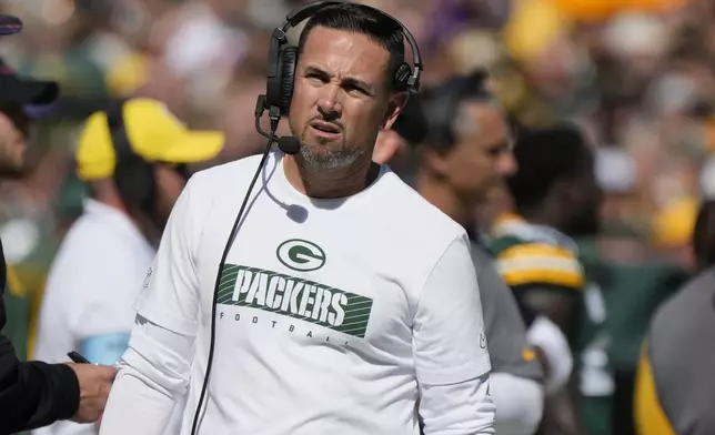 Green Bay Packers head coach Matt LaFleur looks onto he field during the first half of an NFL football game against the Minnesota Vikings, Sunday, Sept. 29, 2024, in Green Bay, Wis. (AP Photo/Morry Gash)