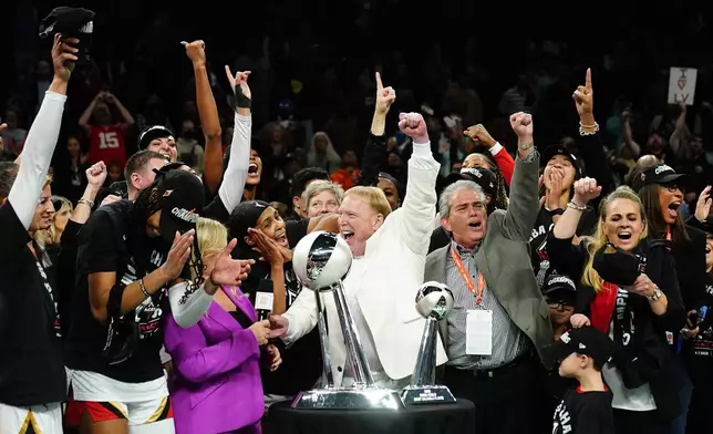 FILE - The Las Vegas Aces celebrate after Game 4 of a WNBA basketball final playoff series against the New York Liberty, Oct. 18, 2023, in New York. (AP Photo/Frank Franklin II, File)