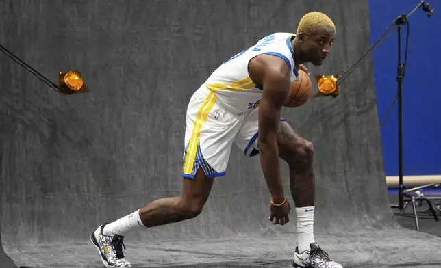 Golden State Warriors' Jonathan Kuminga poses for a photograph during the NBA basketball team's media day Monday, Sept. 30, 2024, in San Francisco. (AP Photo/Godofredo A. Vásquez)