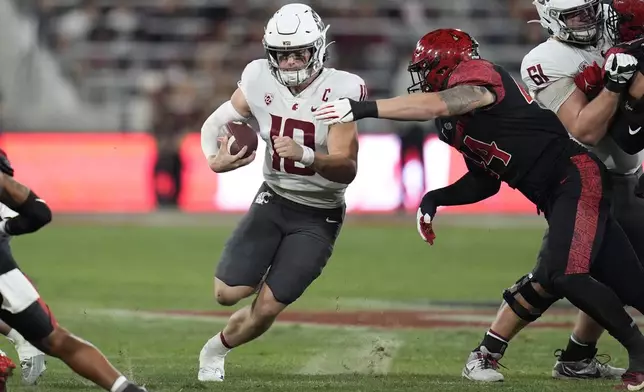 Washington State quarterback John Mateer runs with the ball during the first half of an NCAA college football game against San Diego State Saturday, Oct. 26, 2024, in San Diego. (AP Photo/Gregory Bull)