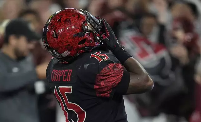 San Diego State running back Marquez Cooper celebrates after scoring a touchdown during the first half of an NCAA college football game against Washington State Saturday, Oct. 26, 2024, in San Diego. (AP Photo/Gregory Bull)