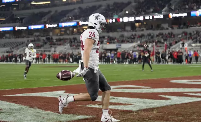 Washington State tight end Cooper Mathers celebrates after scoring a touchdown during the first half of an NCAA college football game against San Diego State Saturday, Oct. 26, 2024, in San Diego. (AP Photo/Gregory Bull)